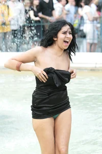 Fountain girl in a skirt accidentally shows her tits and panties