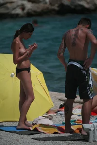 3 amazing topless girls on a nudist beach