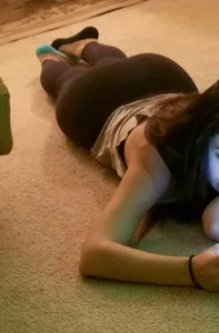 Teen cousin laying on the floor with her phone