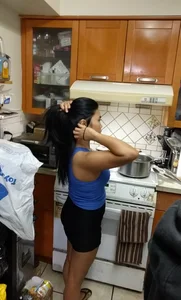Asian girlfriend doing dishes in spandex shorts