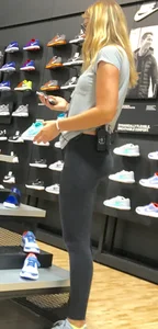 Shoe store employee with a sexy bubble butt in leggings