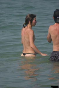 A bunch of sexy beach voyeur babes in bikinis, thongs and topless
