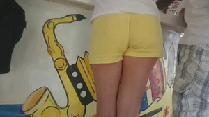 Milf in yellow shorts with vpl and a wedgie