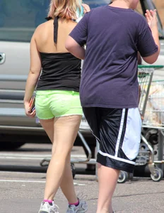 Blonde girl in glasses with a thick booty in green shorts