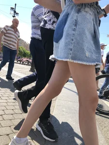 Teen Candid Girl in a Denim Skirt And Sneakers With Thin Legs on a Crosswalk Creepshots
