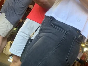 Bunch of girls in various outfits at a Cardinals baseball game