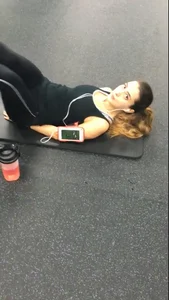 Sexy gym girl with a nice body in leggings as she works out
