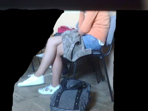 Crossed Legs of a Teen College Girl in Sneakers And Pantyhose Photo in Class
