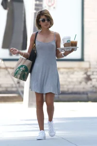 Sarah Hyland showing pokies while braless in a dress