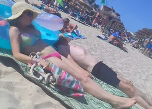 Milfs and girls resting at the beach in sexy bikinis