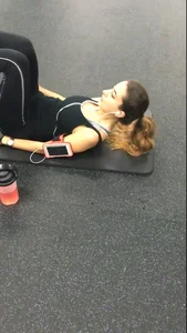 Sexy gym girl with a nice body in leggings as she works out