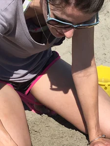 Skinny Candid Wife in Mini Shorts Standing on Her Knees on Sand at the Beach Creepshot
