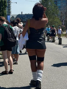 Cheeks hangin’ out of little black skirt