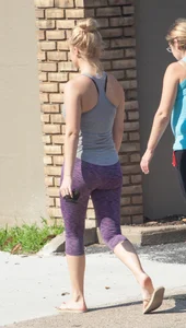 Sexy blonde out walking in purple leggings with a nice ass
