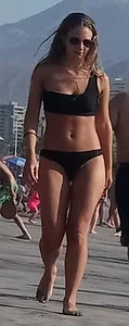 Black thong beach babe with slight pokie