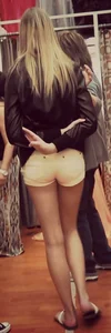 Skinny blonde girl in little yellow shorts with a tight ass