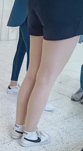Candid teen's legs and booty in tight spandex shorts closeup