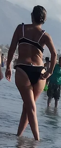 Milf with a big booty in a bikini at the beach