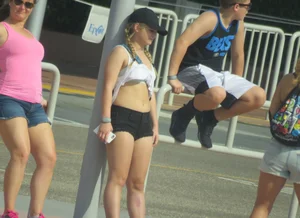 Couple of babes standing around in shorts