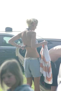 Blonde babe changing into and out of bikini and shows her tits