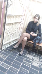 Cute Girl in Skirt, Pantyhose and Flats Sitting Cross-Legged Creepshot