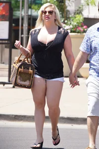 Thick blonde with big boobs in short white shorts
