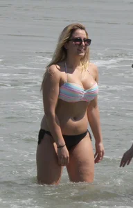 Big boobed thick blonde on the beach in a bikini
