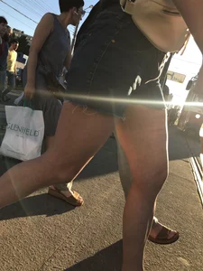 Cute candid teen wearing denim shorts crossing the street, awesome muscly legs