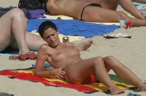 Topless girls on a beach in Barcelona