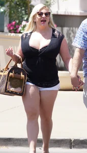 Thick blonde with big boobs in short white shorts