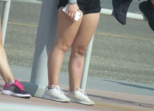 Couple of babes standing around in shorts
