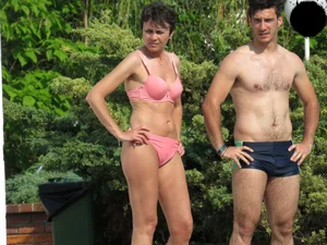 Milf at the pool in a pink bikini with camel toe