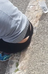 Short haired milf sitting showing her thong
