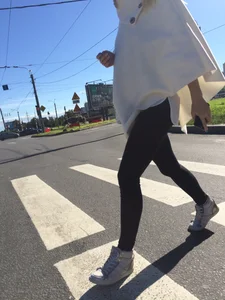 Blonde Girl With Fit Muscular Legs in Tight Black Jeans and Sneakers on a Crosswalk  - Street Creepshots Collection
