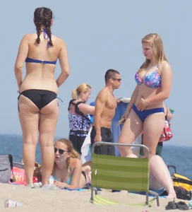3 girls on the beach in bikinis with big boobs, one brunette and two blondes