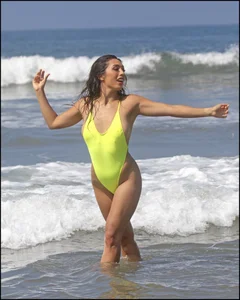 Sexy ass beach babe in a yellow thong swimsuit