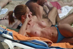 Girls on a nude beach in Sitges, Spain