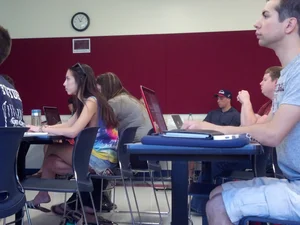 College girl in class showing sideboob with no bra on