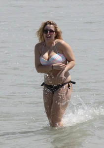 Big boobed thick blonde on the beach in a bikini