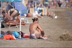 Girls on a nude beach in Bibione, Italy