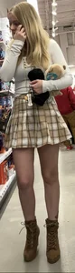 Busty butter face in a skirt and tight top
