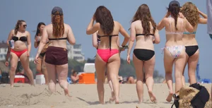 Group of sexy girls on the beach in bikinis with nice bodies