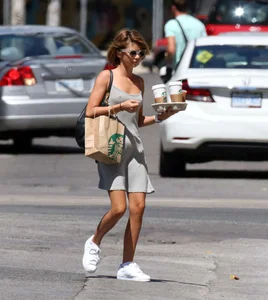 Sarah Hyland showing pokies while braless in a dress