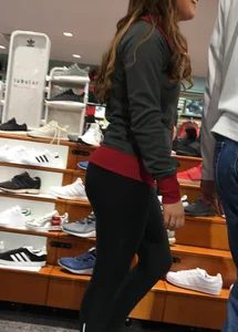 Pretty girl shopping with boyfriend in leggings with a nice ass