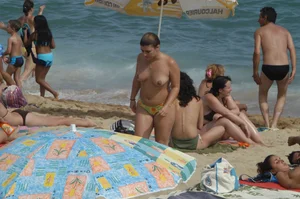 Topless girls on a beach in Barcelona