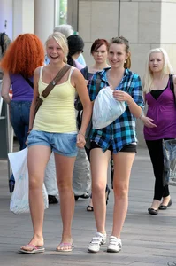 Pretty blonde and brunette friend walking in shorts