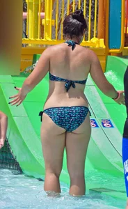 Thick brunette in a bikini while in the pool