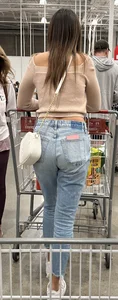 Tight plump college girl ass in jeans with a small wedge