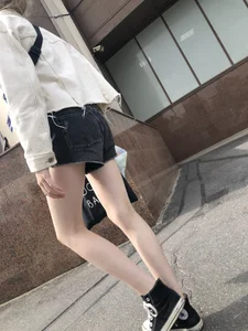 Cute candid teen with pale slim legs in shorts