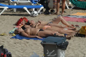 Girls on a nude beach in Sitges, Spain